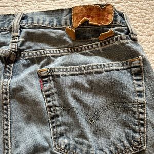 Distressed Levi jeans.